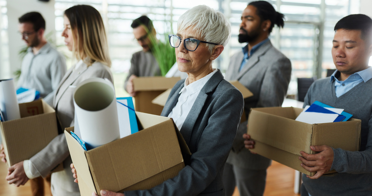 employees leaving the office after being downsized